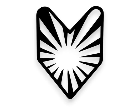 A black and white geometric shield-shaped emblem with a sunburst design, shown on a plain white background.