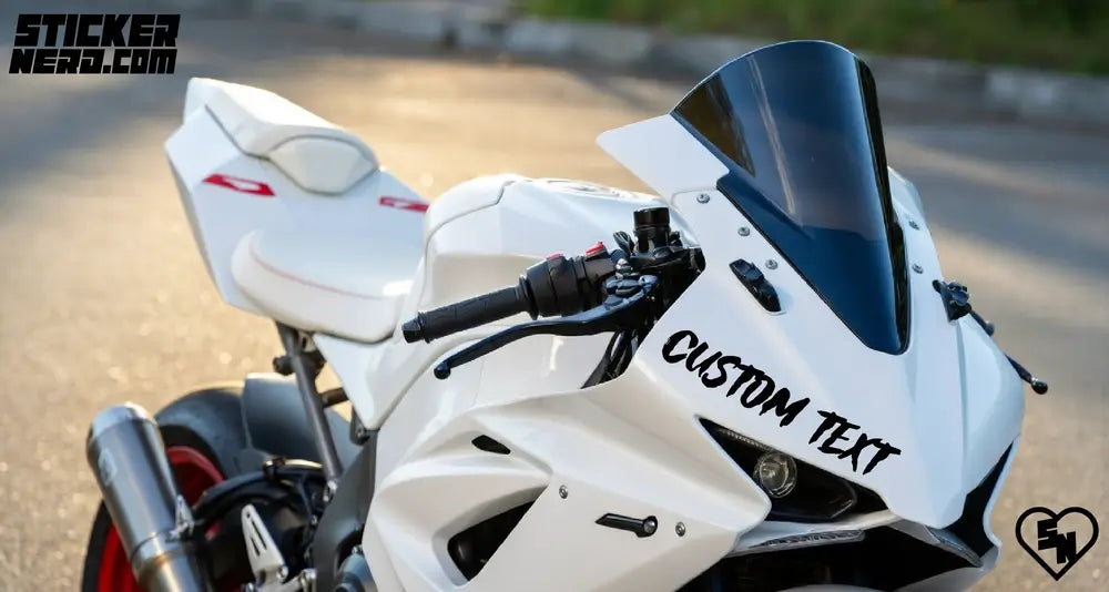 White motorcycle with 'CUSTOM TEXT' on a blurred road background