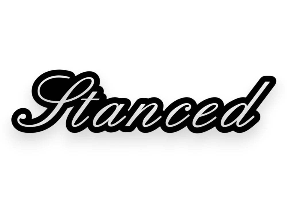 The word 'Stanced' written in a black cursive script with a white outline, presented on a solid white background.