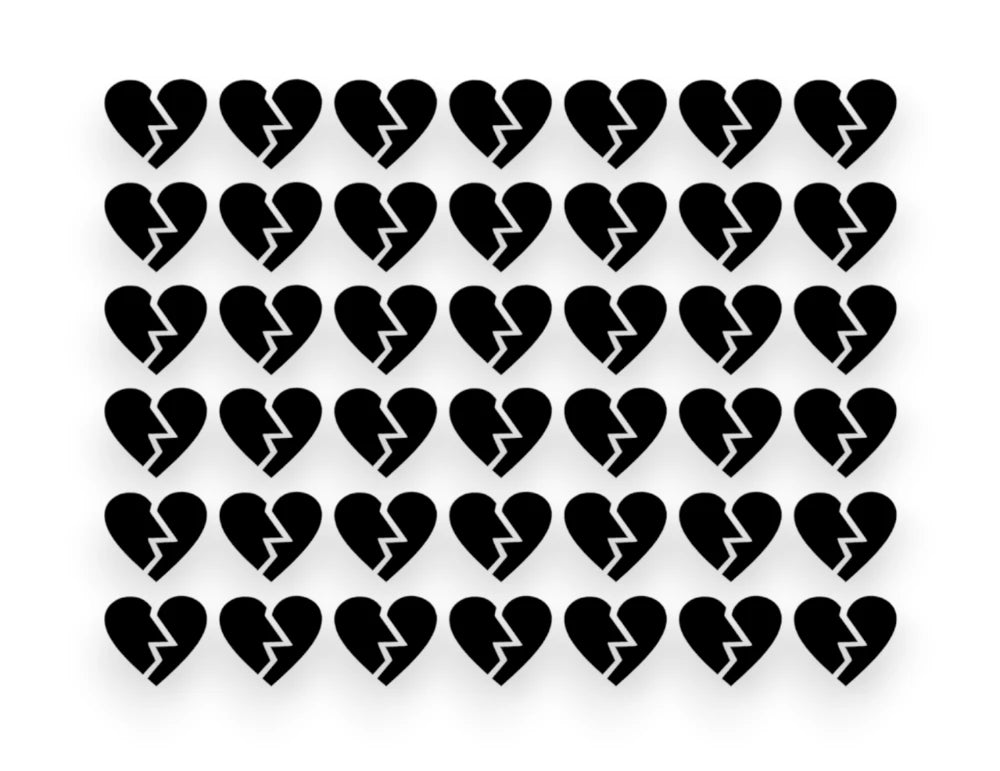 A sticker pack sheet featuring a grid of small, black broken heart vinyl decals with a jagged crack down the middle on a white background.
