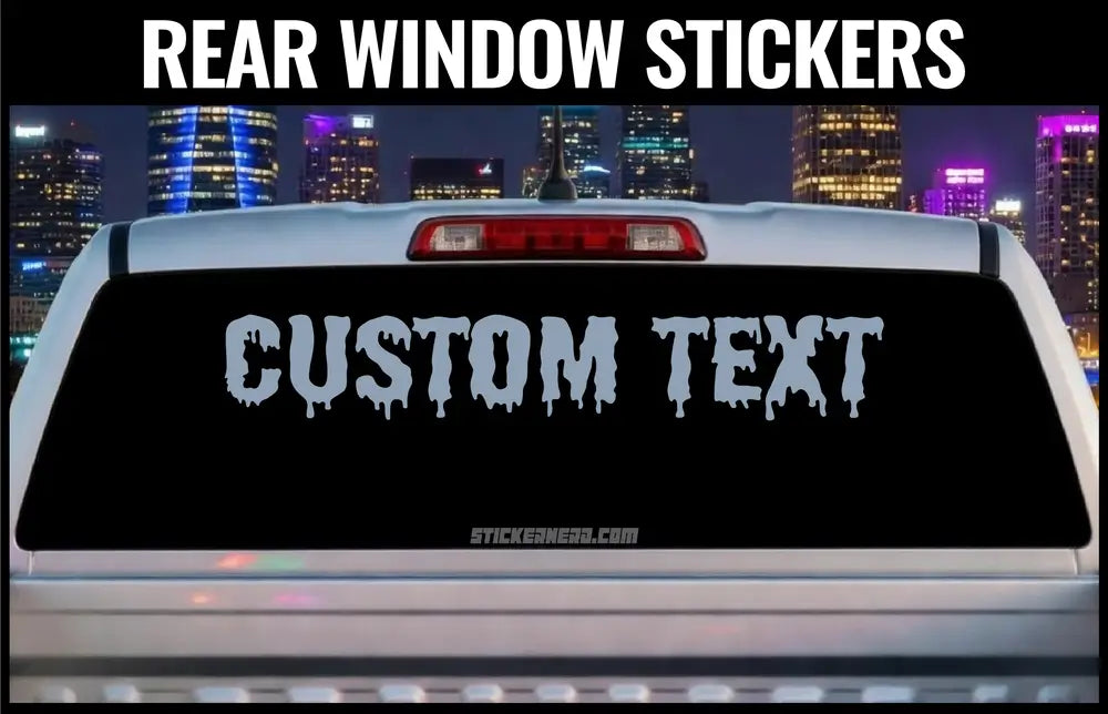 Car with a custom text rear window sticker against a cityscape at night. Custom rear window stickers for cars and trucks - custom decals and stickers